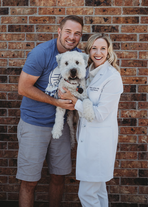 Dr. Humlicek with her husband and dog