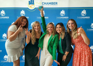 staff of Humlicek posing with their award from the Wichita chamber