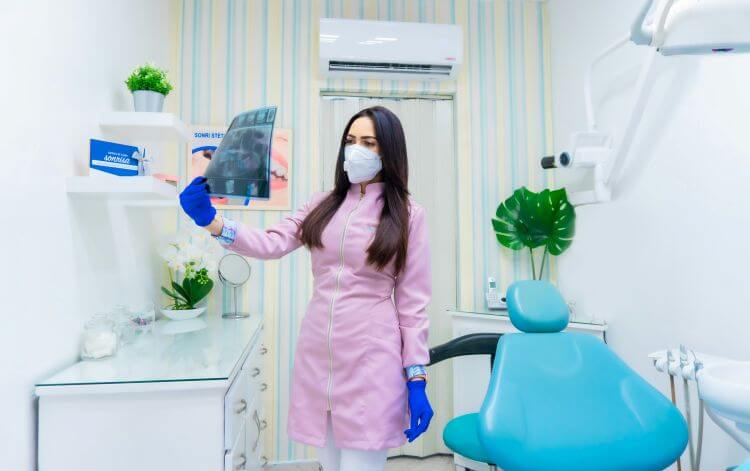 Dentist looking at x-rays.
