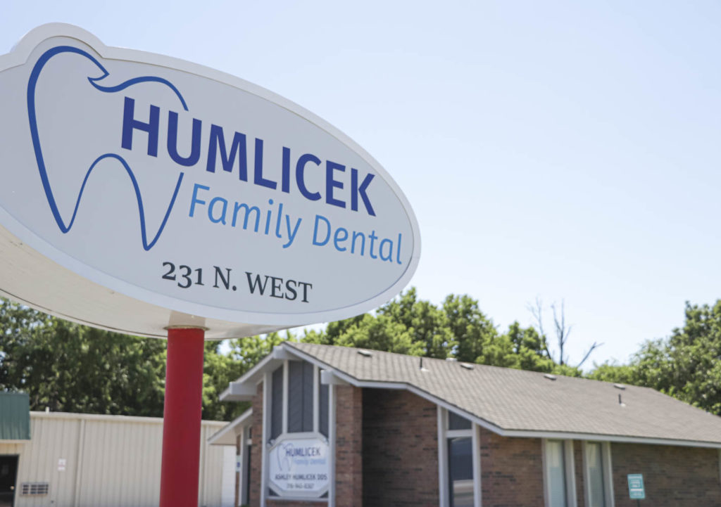 The outdoor sign and exterior of the Humlicek Family Dental office