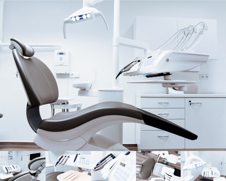 a black dental chair in a clean patient room